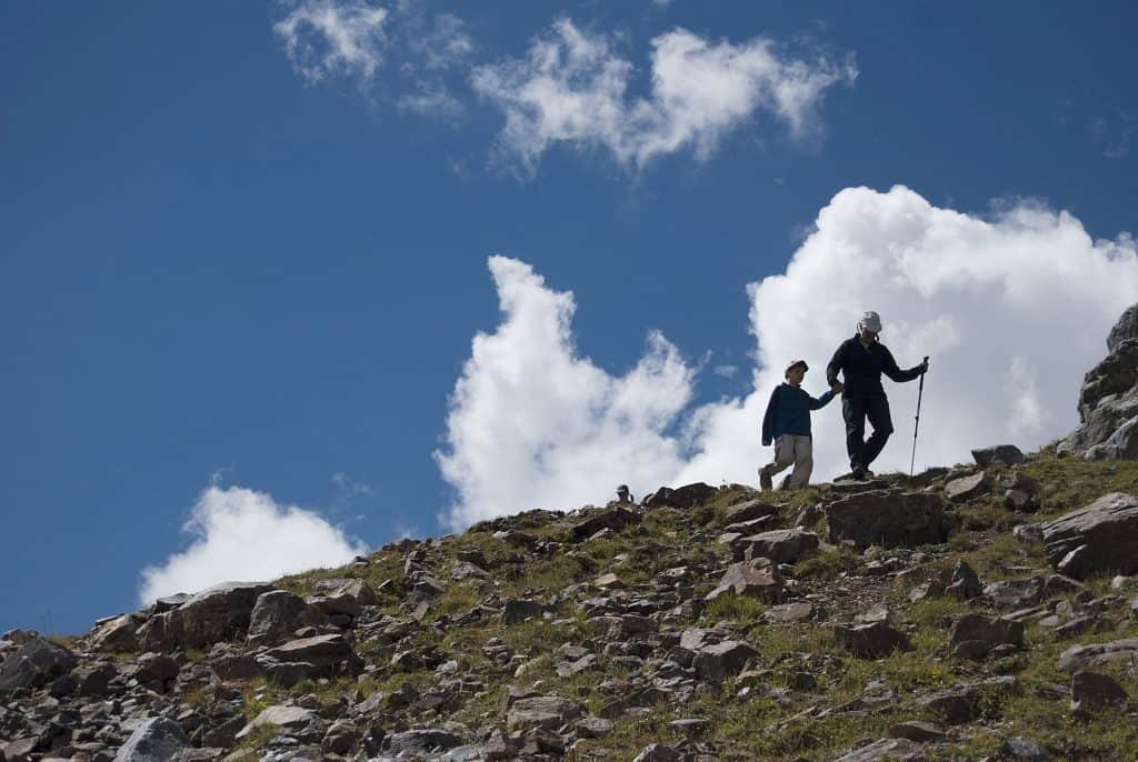 Two people hiking in southwest Colorado on a ridge